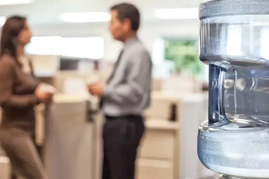 Modern bottleless water dispenser in an occupied workplace