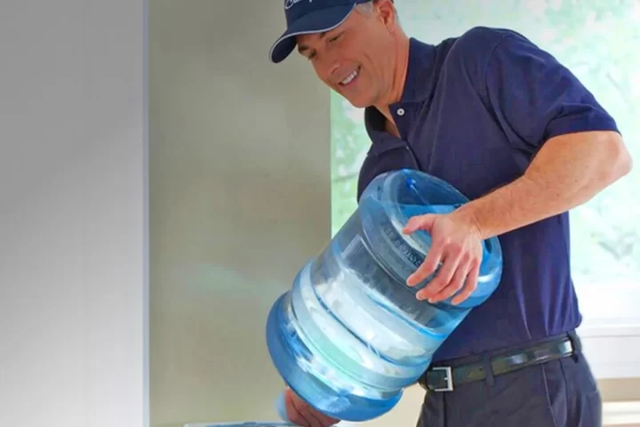 Office team reviewing water filtration equipment and service requirements