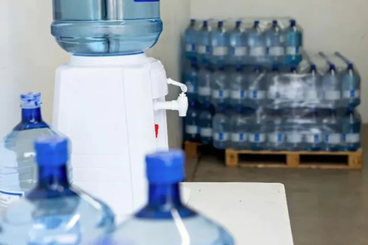 Property manager reviewing a shared office water station
