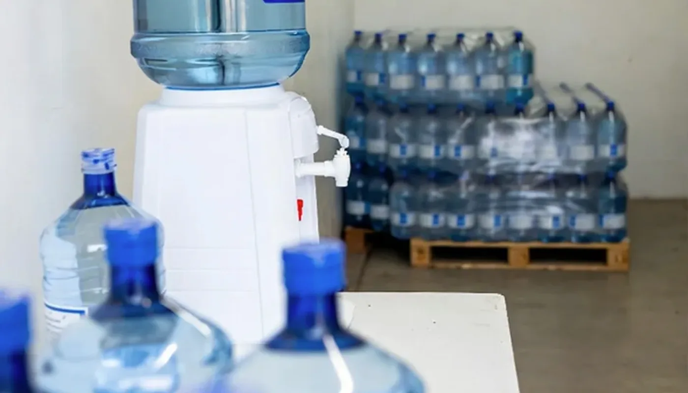 Property manager reviewing a shared office water station