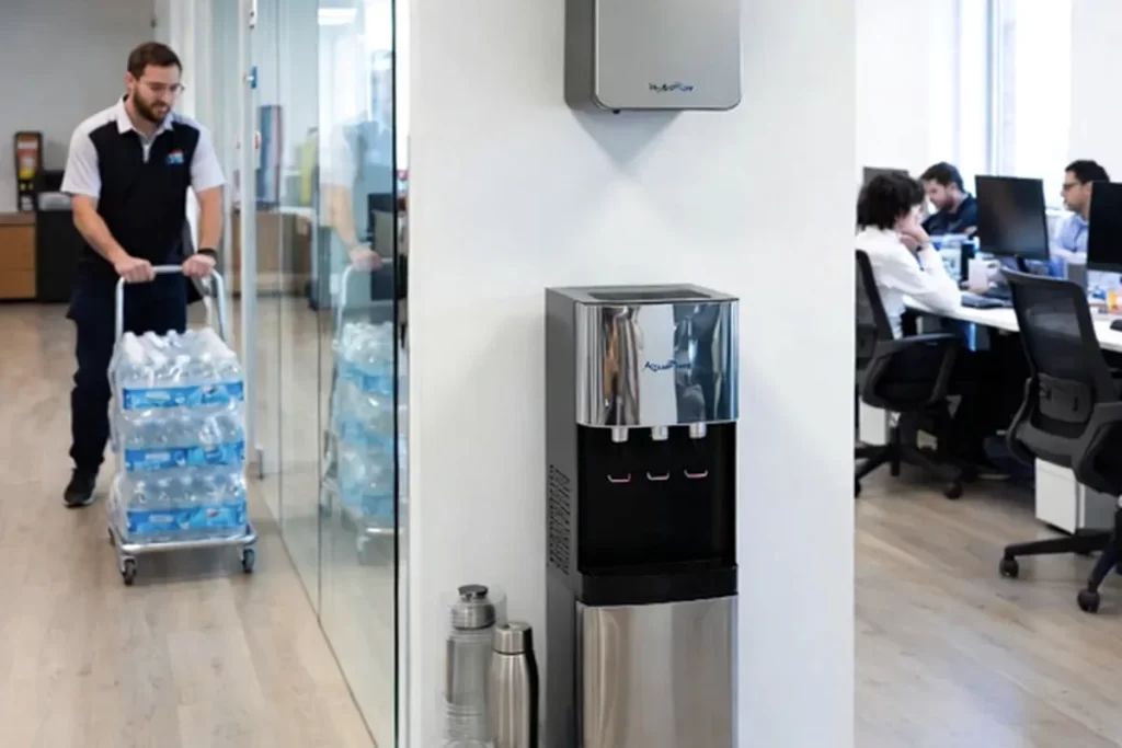 Project staff using water station inside a jobsite trailer